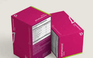 Two pink product boxes facing each other, with a visible nutrition facts label on the front box (Greek text).