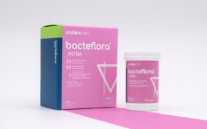 Pink Bacteflora Intim probiotic box and matching bottle on a white surface, branding clearly visible.