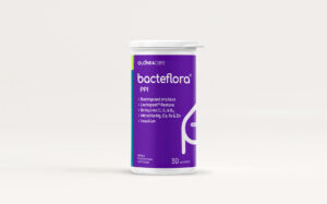 Purple probiotic bottle labeled 'bacteflora PPI' with a white cap, 30 capsules, on a white surface.