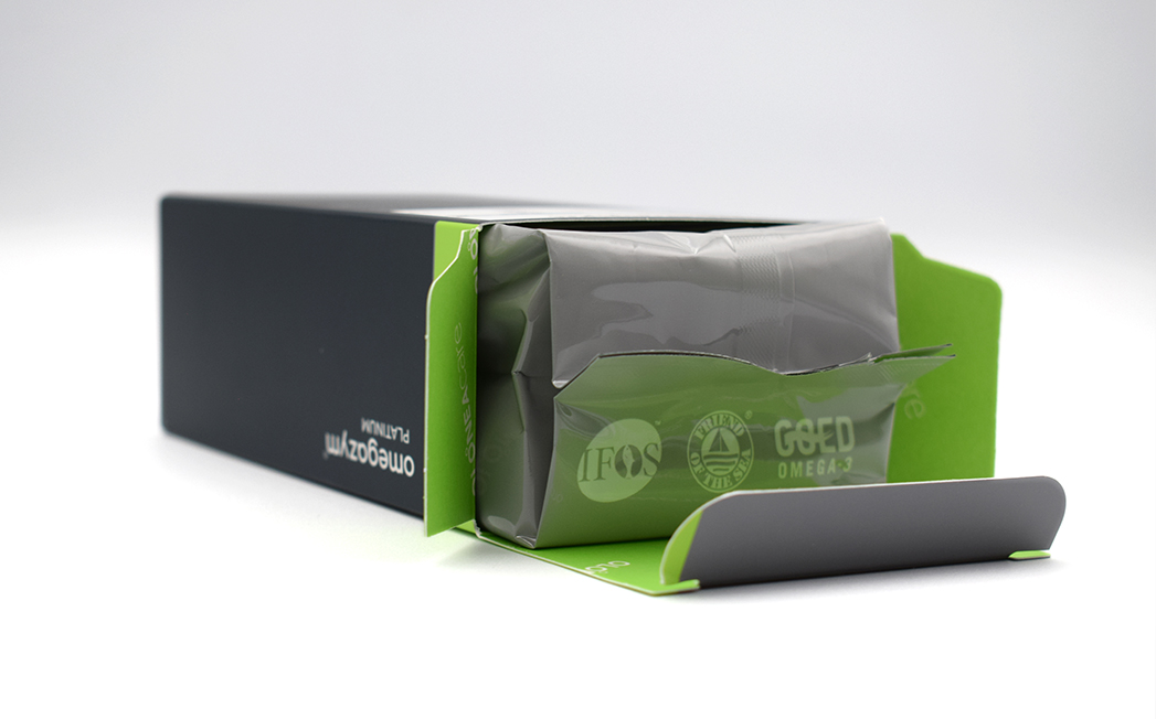 Green and gray packaging partially opened, exposing a gray inner pouch inside the box.